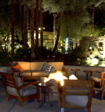 Patio furniture pool side lit up at night - Big Easy Patio